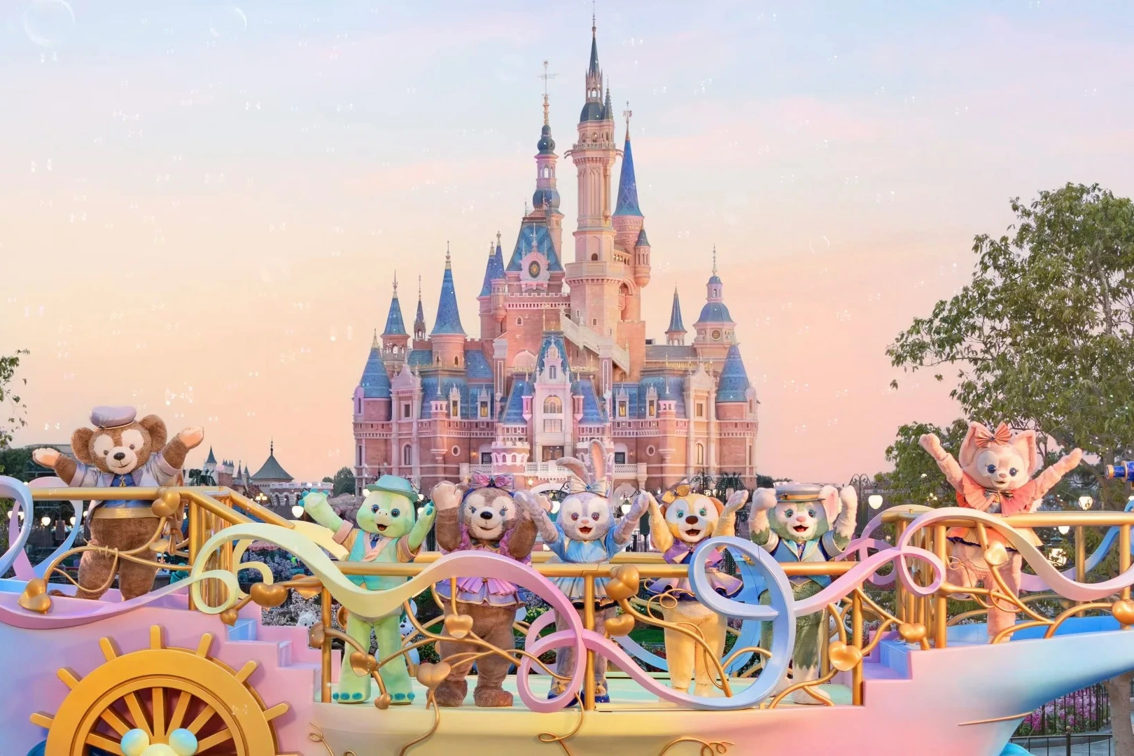 Shanghai Disney castle at golden hour — the world's only mainland Disney park, with the TRON coaster spire in the background