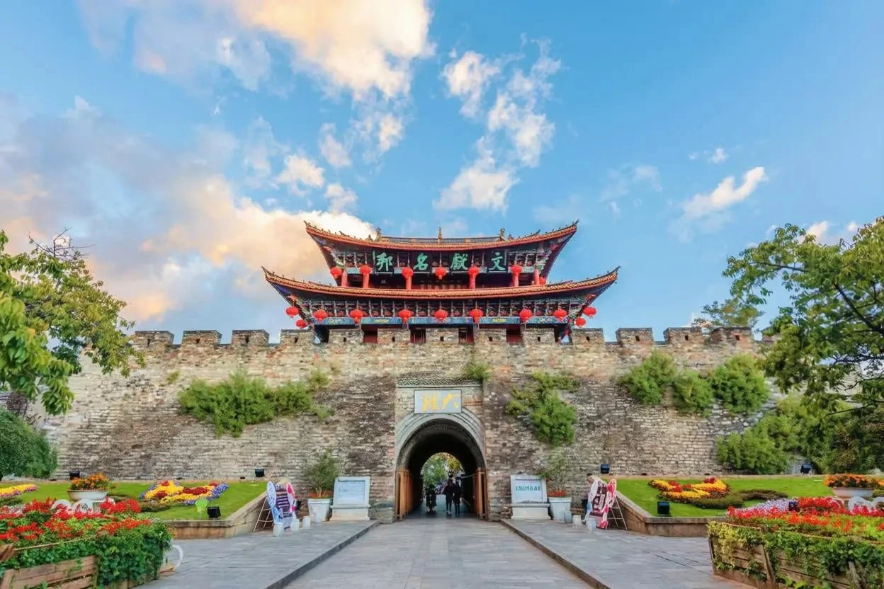 Dali Ancient City South Gate tower with red lanterns and stone walls