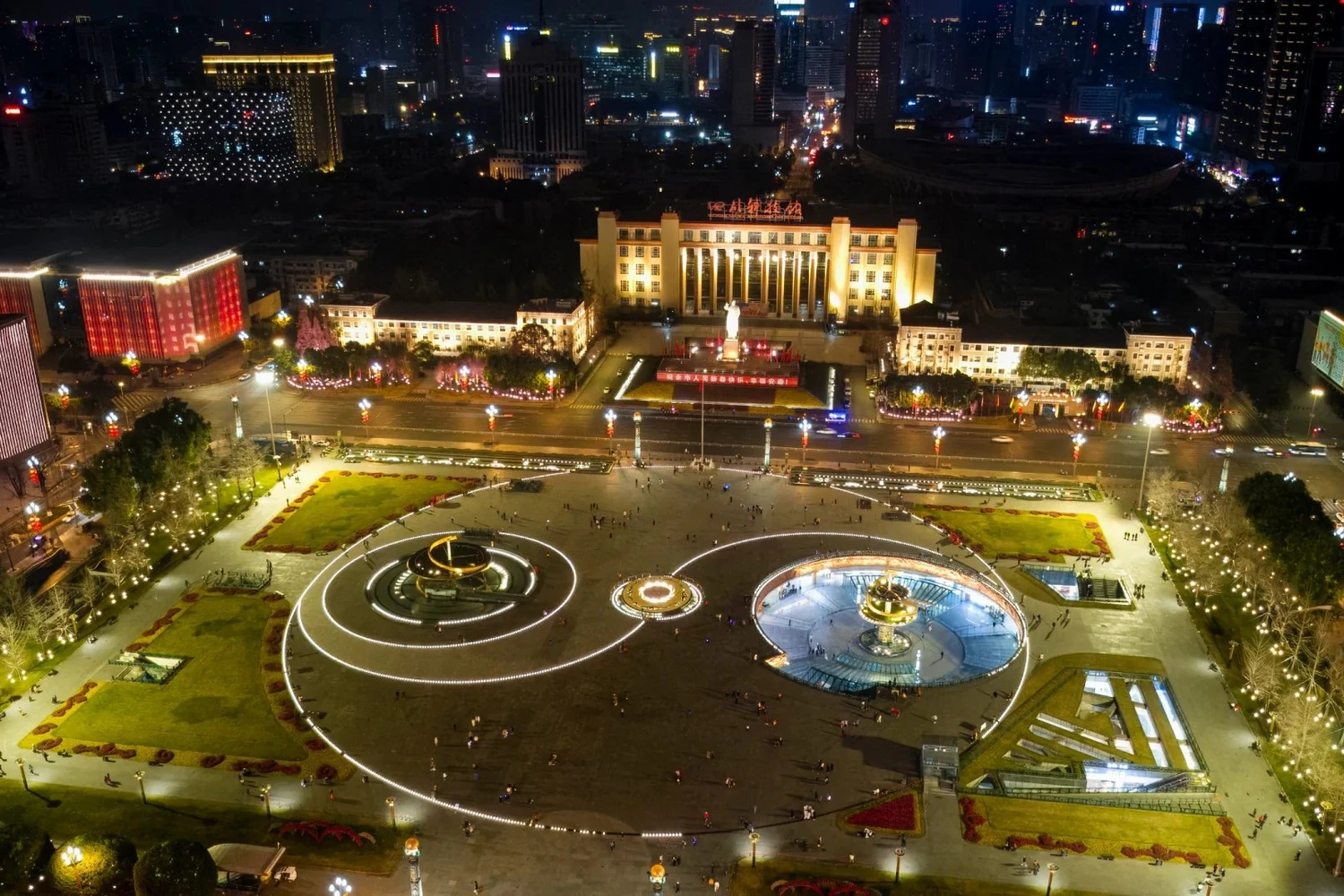 Tianfu Square with Mao statue and modern Chengdu buildings at dusk